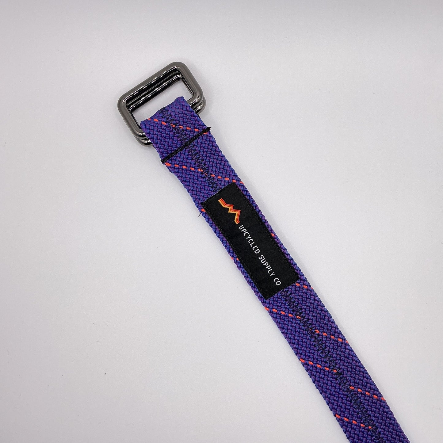 Purple strap with a buckle on a white background