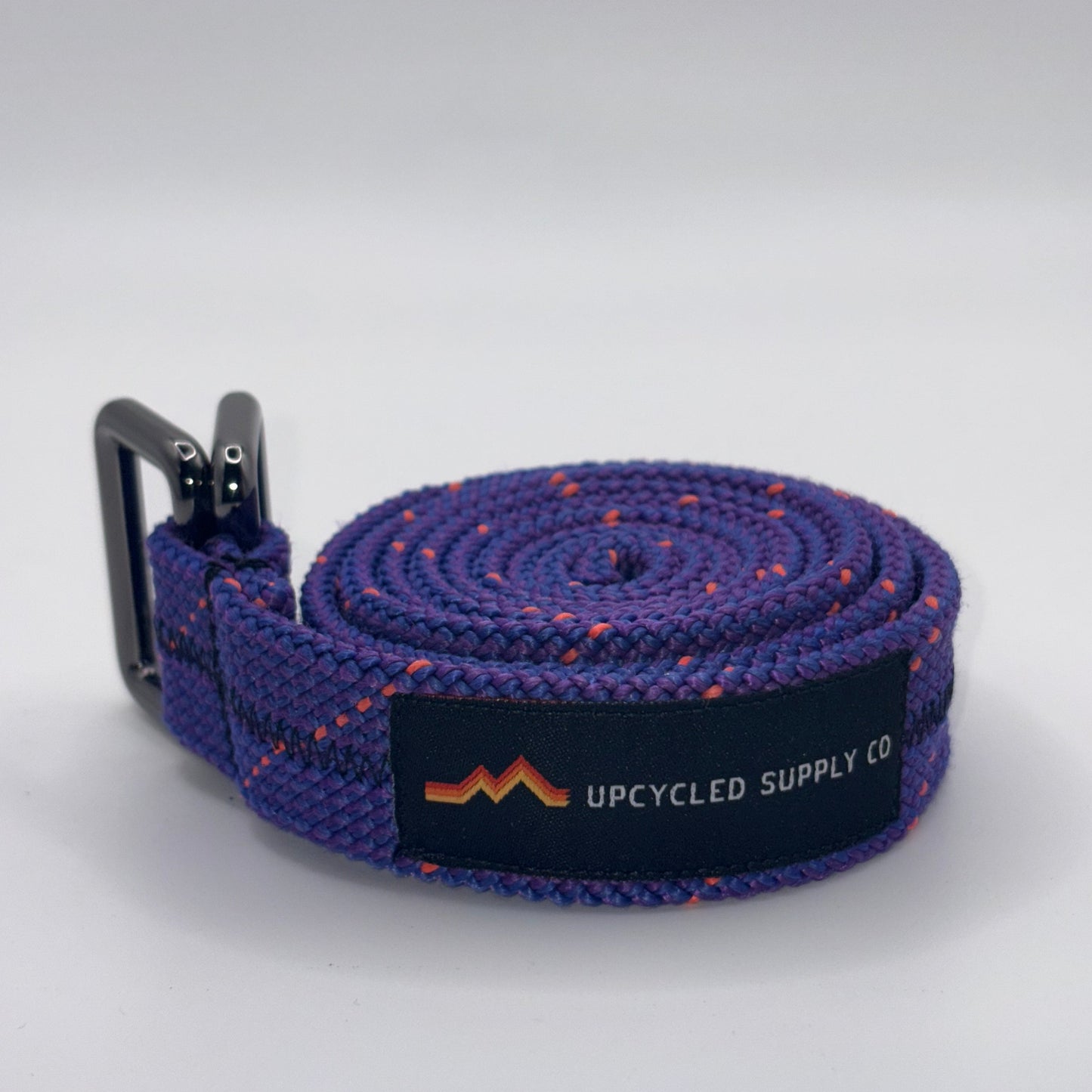 Purple belt with a black label on a white background