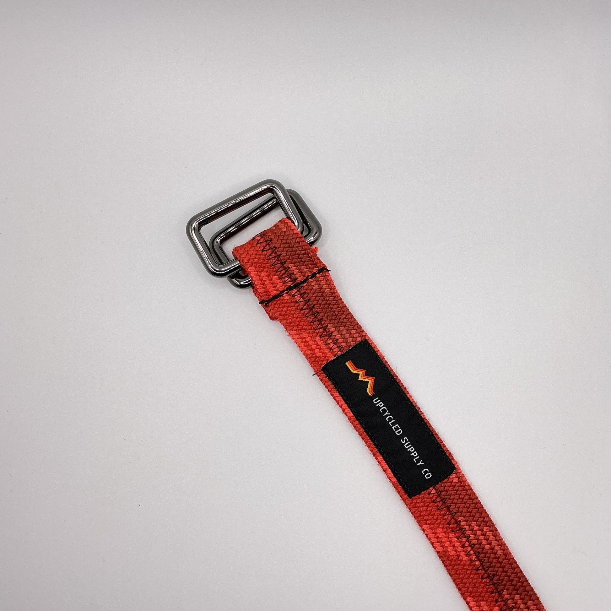 Red strap with a black label on a white background