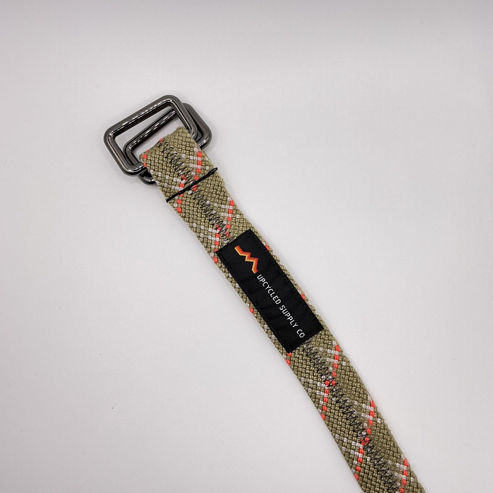 Woven belt with a buckle on a white background
