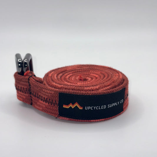 Brown strap with a black label on a white background