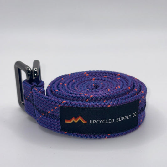 Purple belt with a black label on a white background