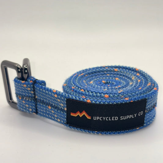 Blue webbing strap with a black label on a white background