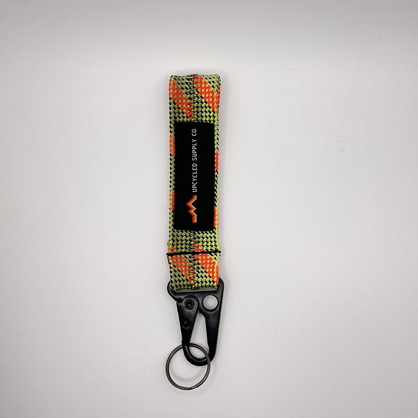 Keychain with a checkered pattern on a gray background