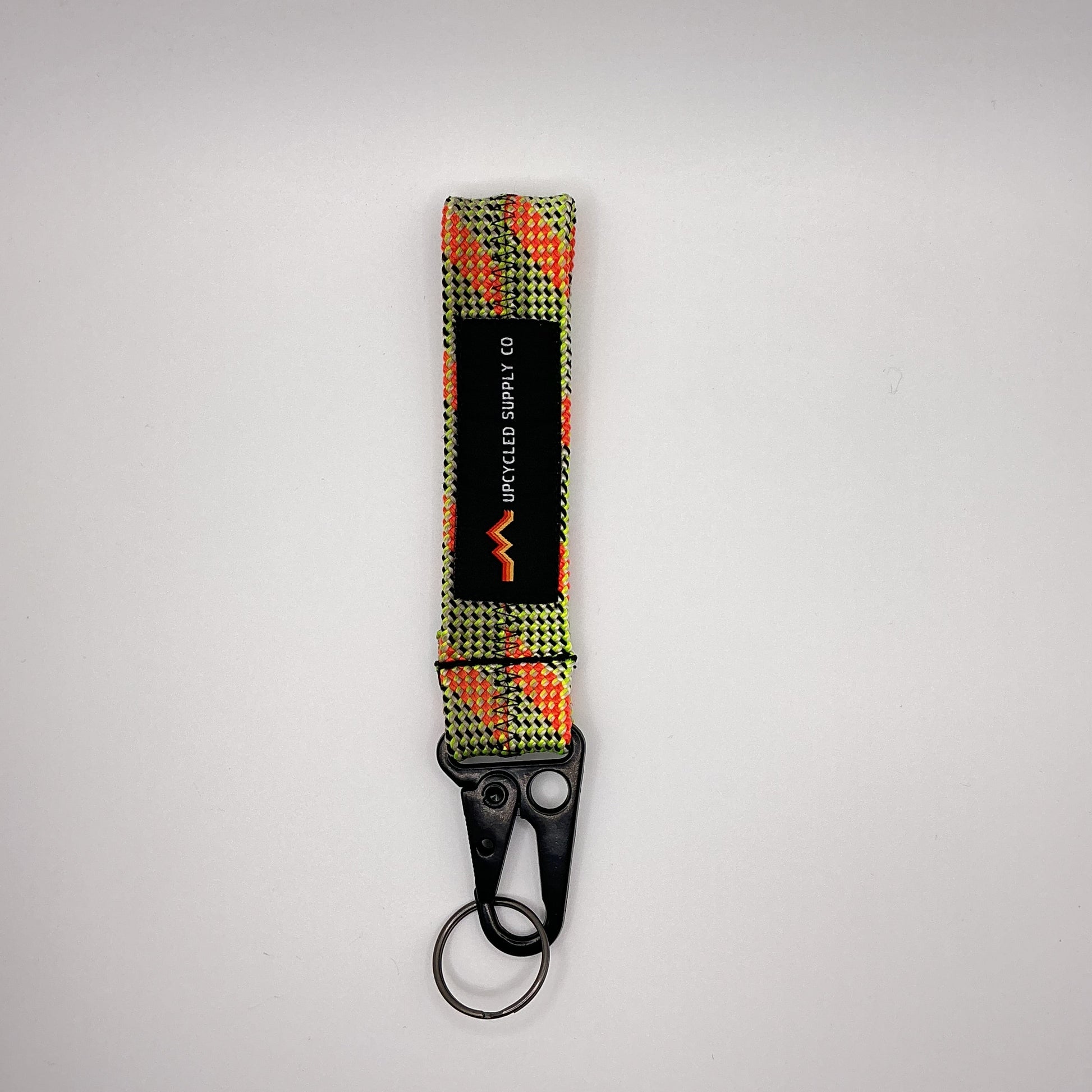 Keychain with a checkered pattern on a gray background