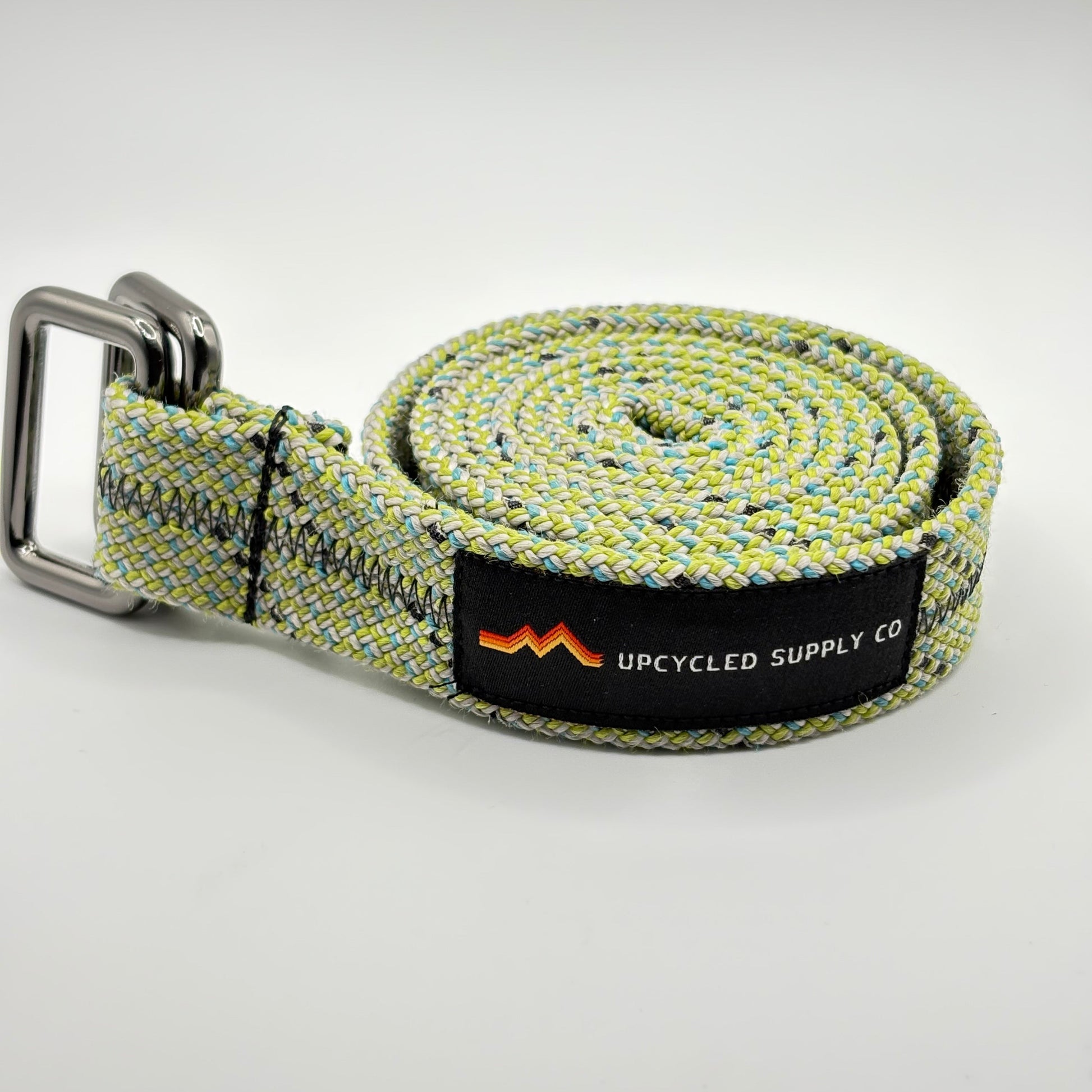 belt with a brand label on a light gray background