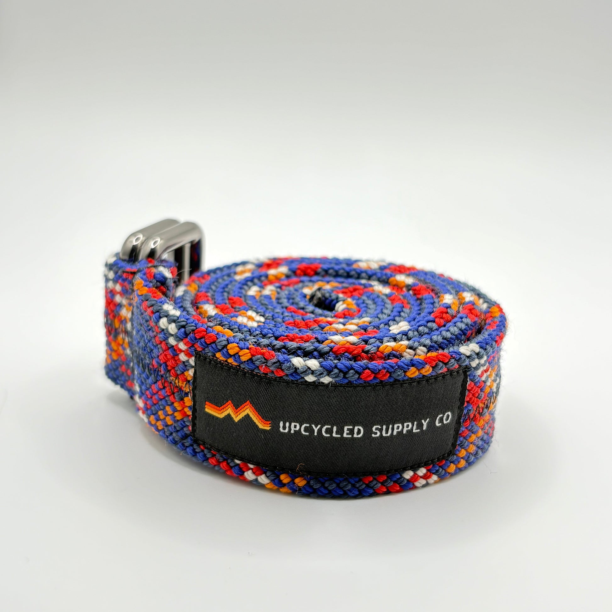 Colorful belt with a brand label on a white background