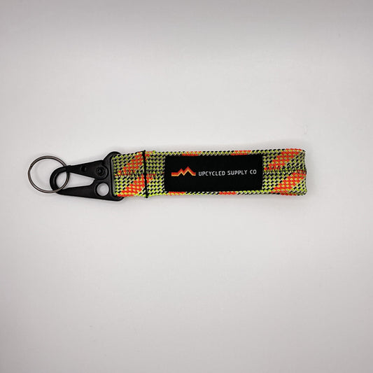 Keychain with a checkered pattern on a gray background