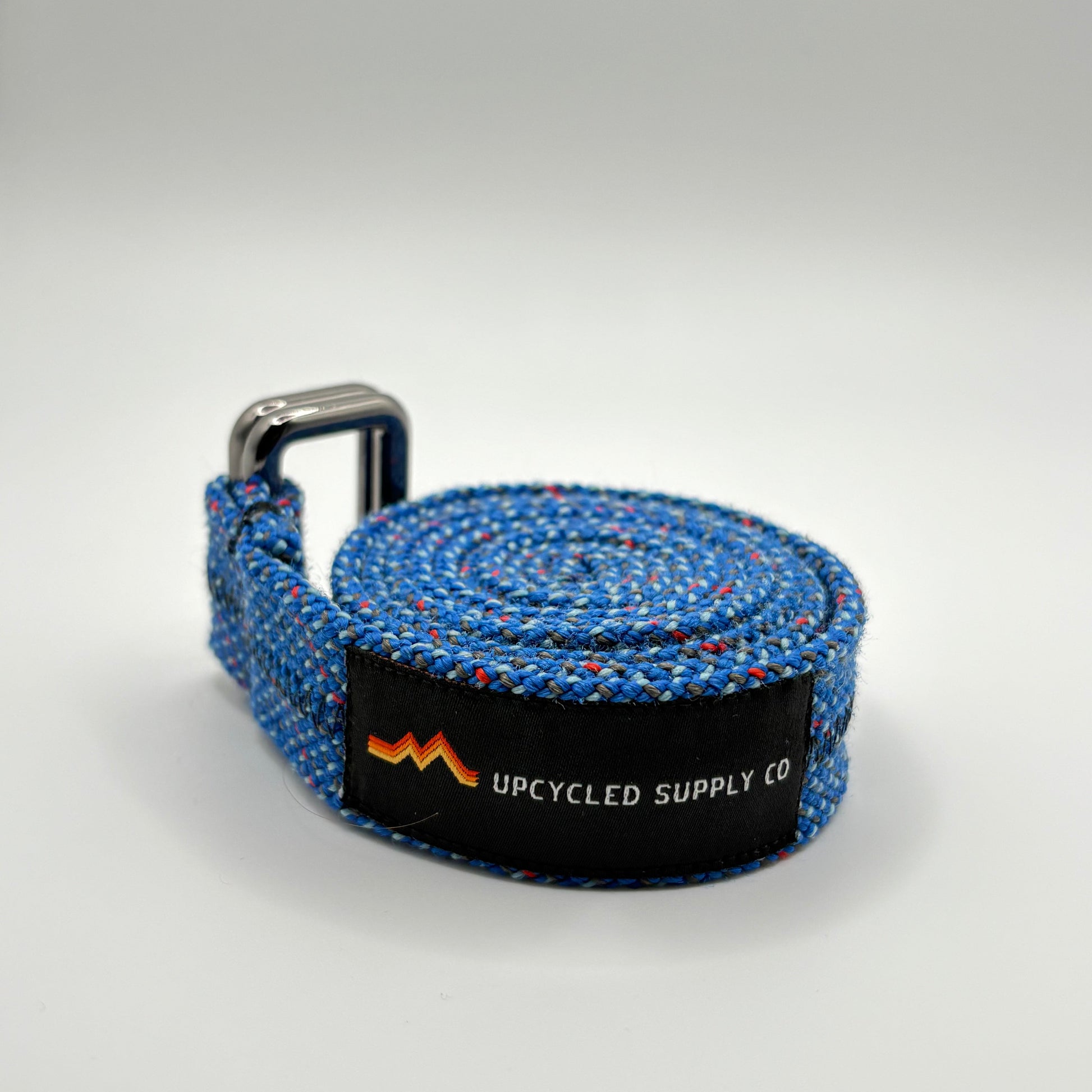 Blue textured strap with a black label on a light gray background