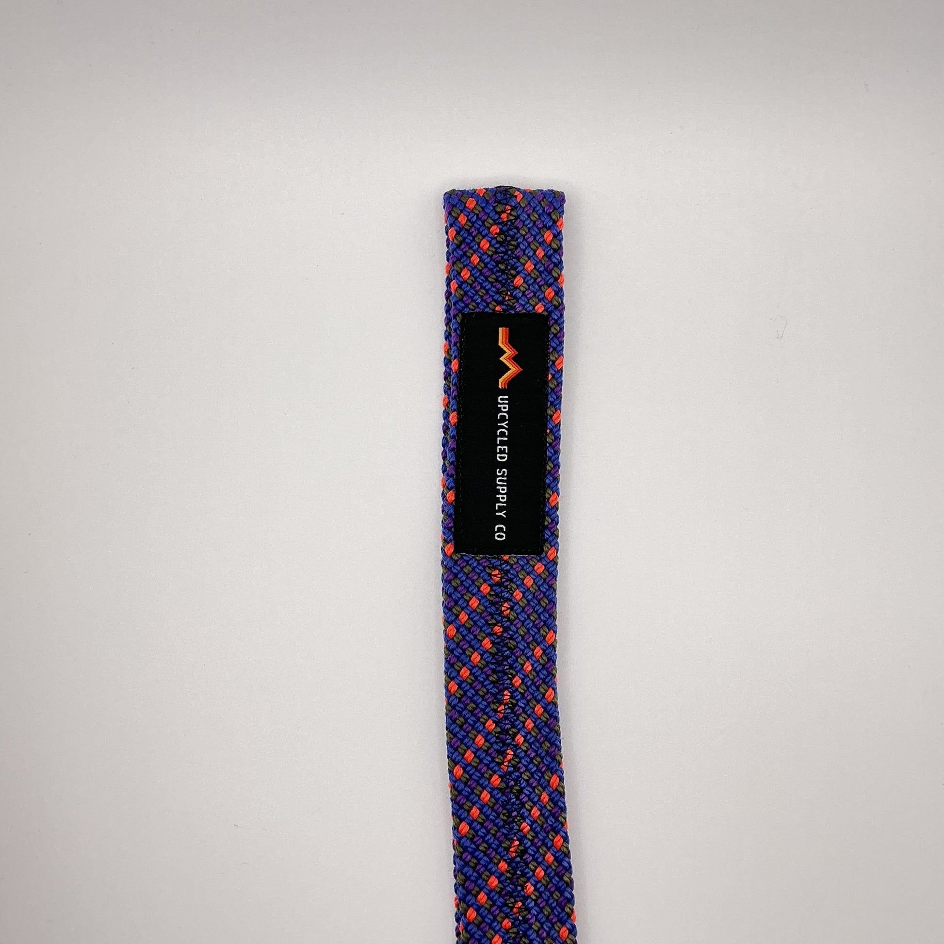 Blue and orange braided rope with a black label on a gray background