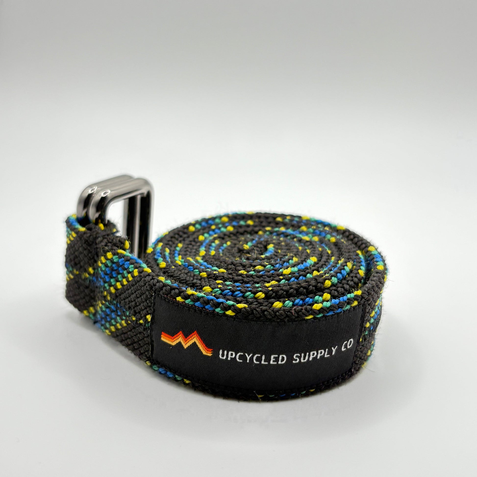 belt with branded tag on a light gray background