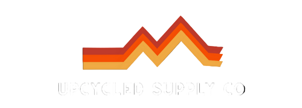 Logo of Upcycled Supply Co with colorful zigzag design on a black background