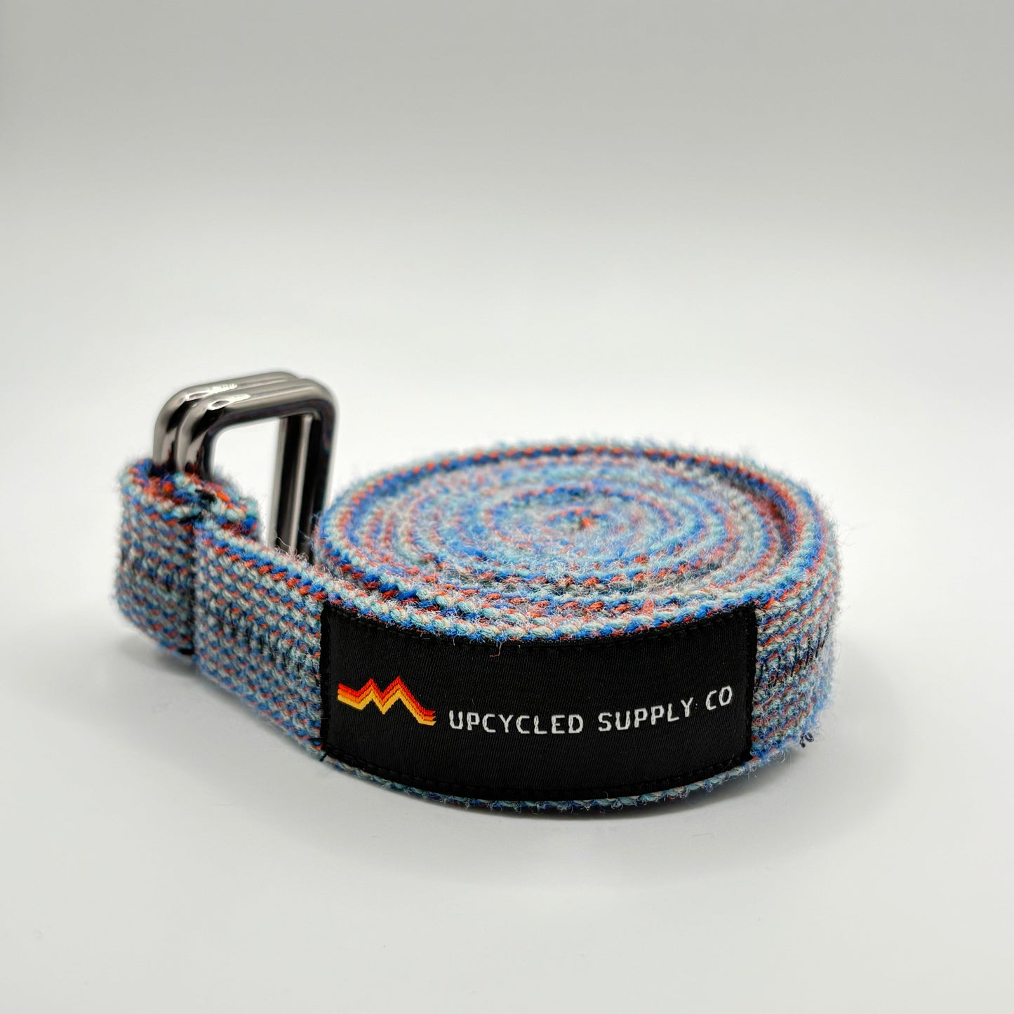 Gray woven belt with a visible brand logo on a light gray background