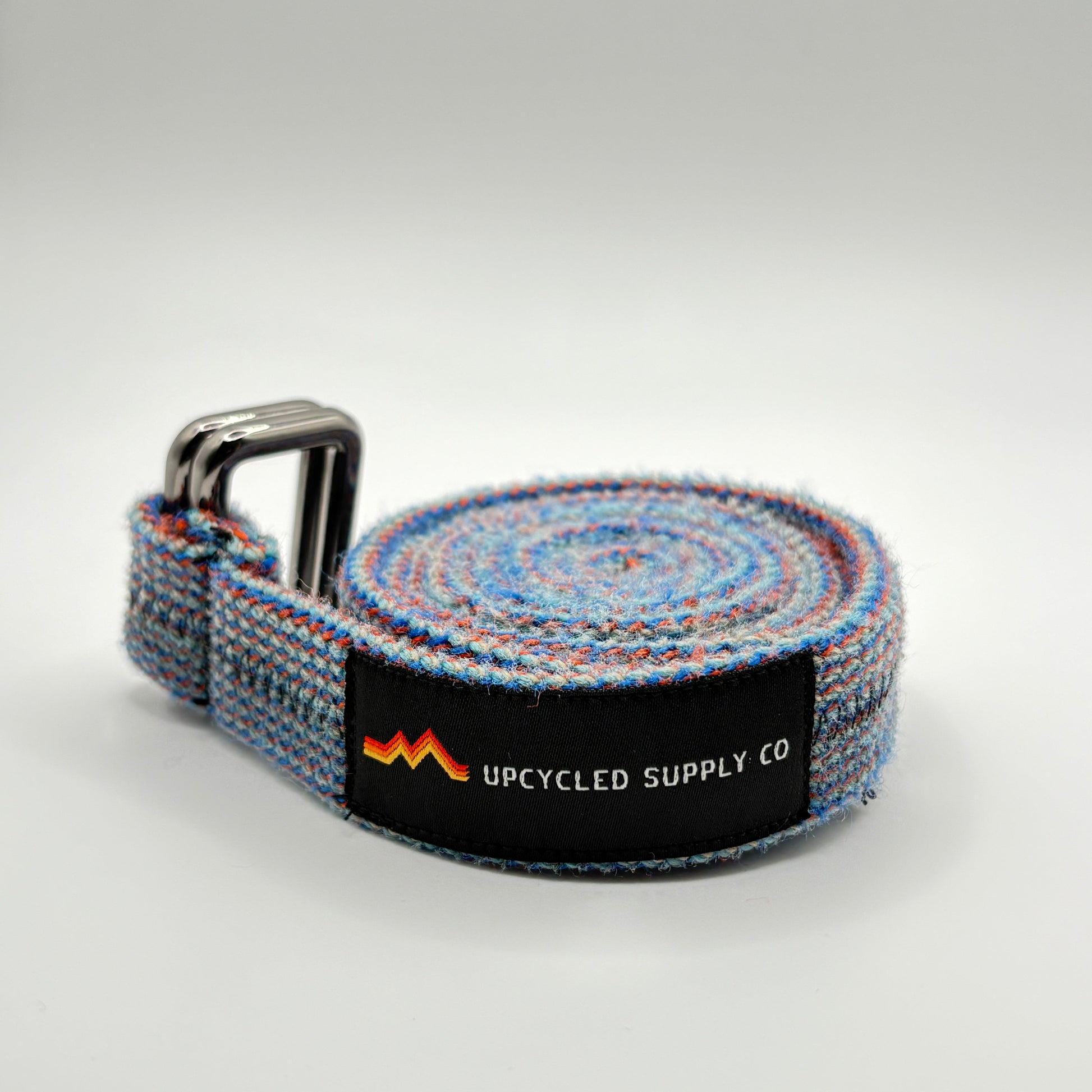 Gray woven belt with a visible brand logo on a light gray background